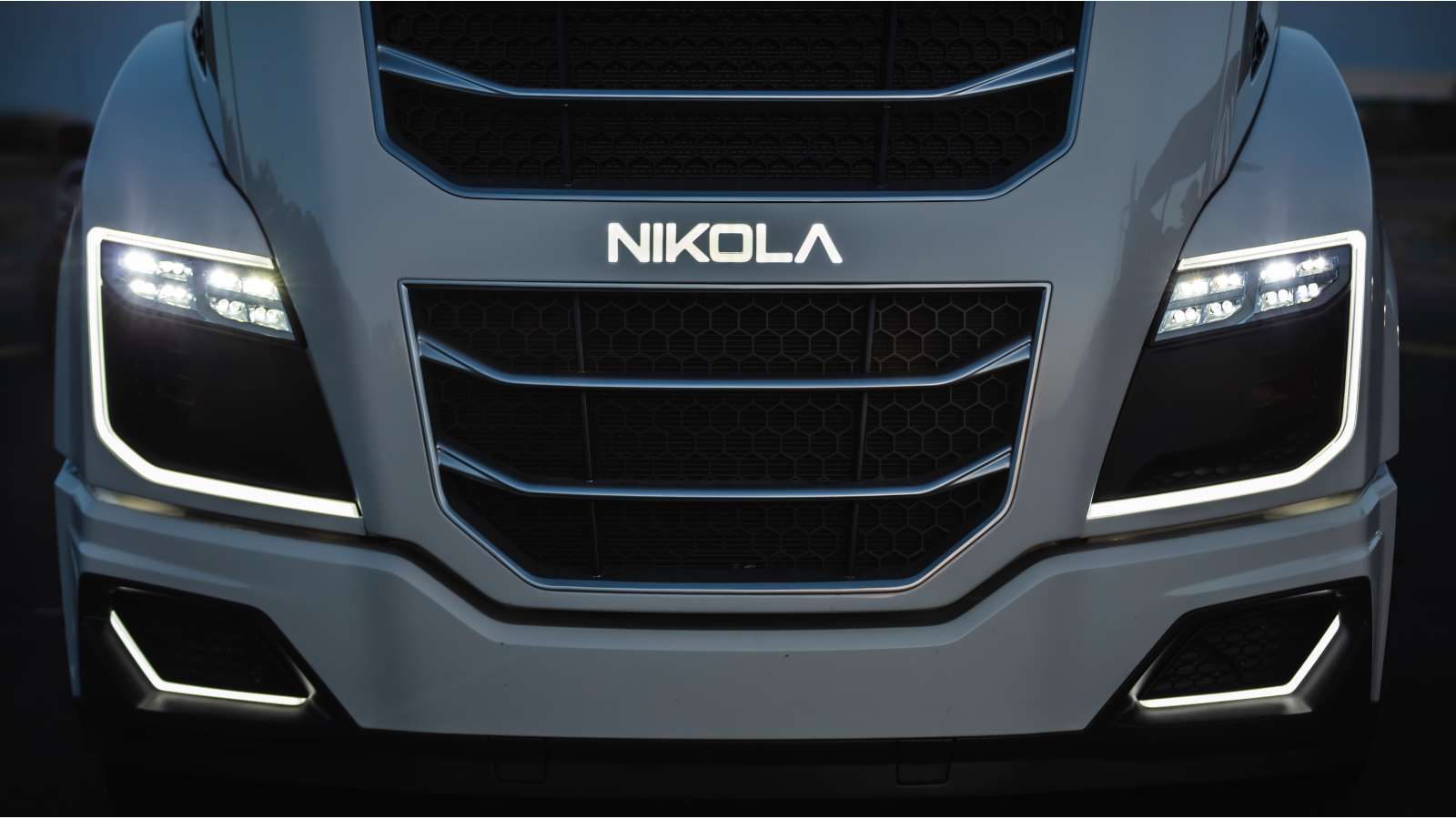 Nikola (NKLA) badge on the front of a matte black car