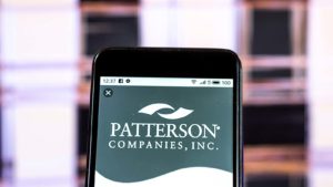 An image of a phone displaying the Patterson Companies, Inc. (PDCO) logo