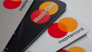 Close-up of a stack of mastercard debit bank cards.