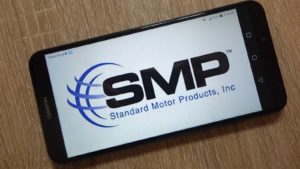 The Standard Motor Products (SMP) logo is displayed on a smartphone.