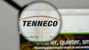 A magnifying glass hovers over the Tenneco (TEN) website.