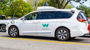 Waymo self driving car performing tests on a street near Google's headquarters, Silicon Valley self-driving car stocks