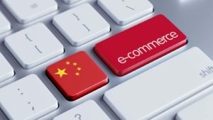 keyboard with the enter key replaced with "ecommerce" and colored like the chinese flag