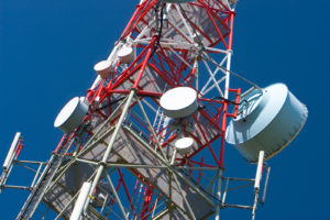 tall communications tower representing communications stocks