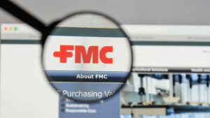 A magnifying glass zooms in on the FMC Corporation (FMC) website.