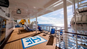 Deck of a Royal Caribbean (RCL) cruise ship looking over the ocean 