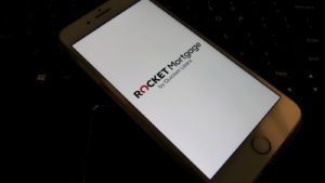Rocket Companies (RKT) Mortgage company on smartphone in dark room