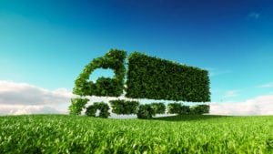 A 3D rendering of a green truck in front of a blue sky. 