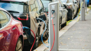 electric vehicles charging at a charging station representing DiamondPeak stock