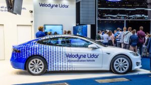 A Velodyne Lidar (GRAF) demonstration car parked at a display. 