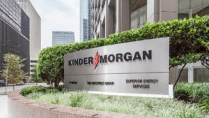 Kinder Morgan (KMI) logo on a sign outside the company headquarters in Houston.