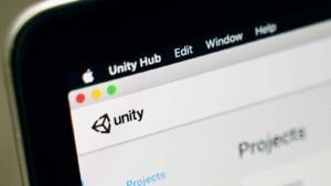 The Unity Software website is displayed on a laptop screen. U stock