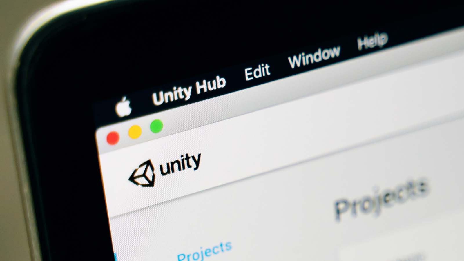 The Unity Software website is displayed on a laptop screen.
