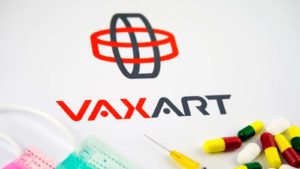 The Vaxart (VXRT) logo is surrounded by face masks, syringes and pills.