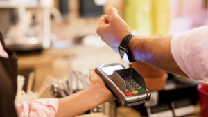 Image of a person checking out using Apple Pay.