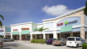 image of a strip mall with several businesses representing RVI stock.