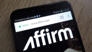 Affirm (AFRM stock) logo displayed on a smartphone representing today's price prediction news.