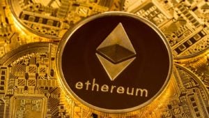 Pile of ether or ethereum coins on golden background.