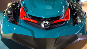 close-up of blue-green ski doo with BRP (DOOO) logo on front
