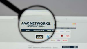 A magnifying glass zooms in on the website for AMC Networks (AMCX).