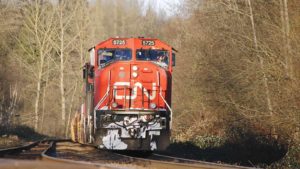 A photo of a Canadian National (CNI) train coming down the tracks toward the photographer.