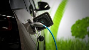 Depth of field shot of an electric vehicle being charged. Chinese EV stocks