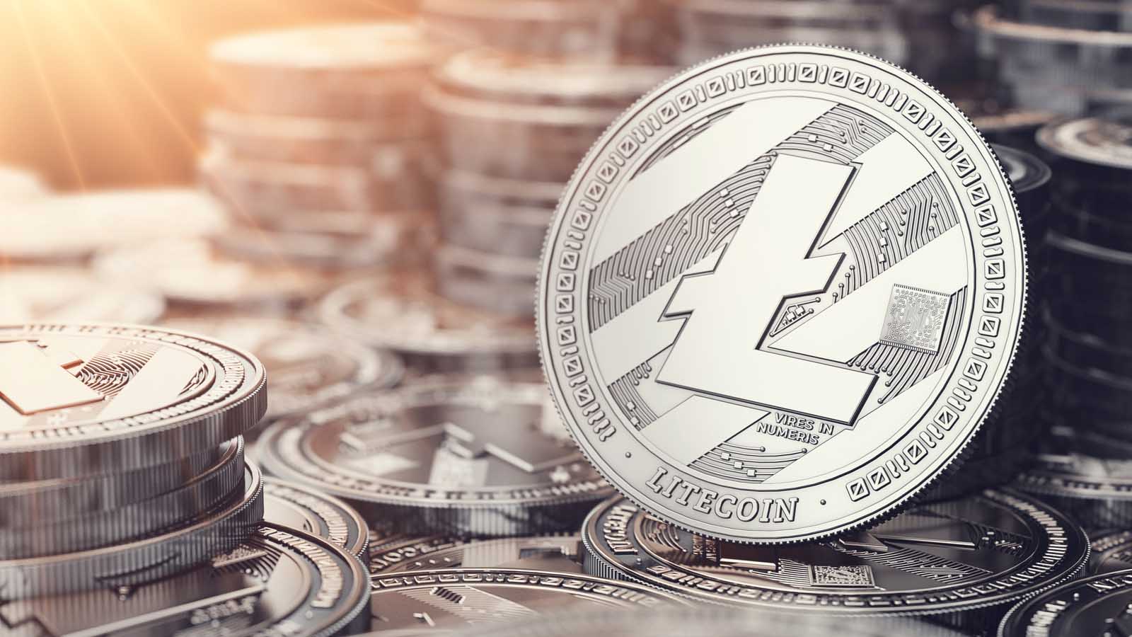 Image of one litecoin in front of many stacks of litecoins price predictions.