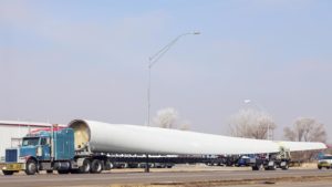 Image of a truck Transporting a wing to the wind farm