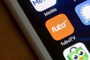  The fuboTV mobile app icon is seen on an iPhone.