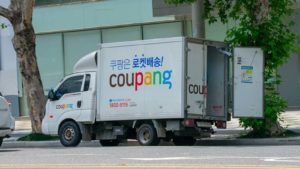 A close-up shot of a Coupang (CPNG) delivery vehicle.