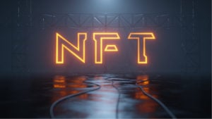 Image of a neon sign spelling out NFT.