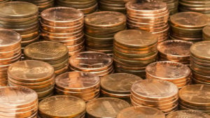 Stacks of pennies sitting around each other.