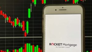 The logo for Rocket Companies displayed on a smartphone screen (RKT). stocks to sell