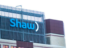 Shaw Communications telecommunications company sign from the top of a building location at Calgary.