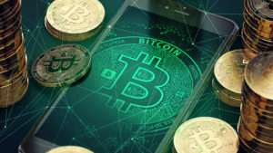 A render of bitcoin surrounding a smartphone representing price predictions.