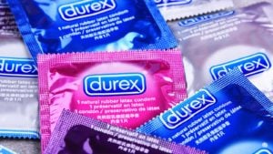 A pile of blue, pink and silver Durex condom wrappers.