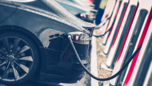 Electric Cars Charging Station Closeup Photo. Vehicle Rechargeable Batteries Charing. Future of Transportation.