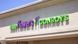 A store front sign for the florist shop known as Conroy's or 1-800-Flowers