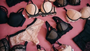 Lingerie on a pink background representing the Naked Brands merger.