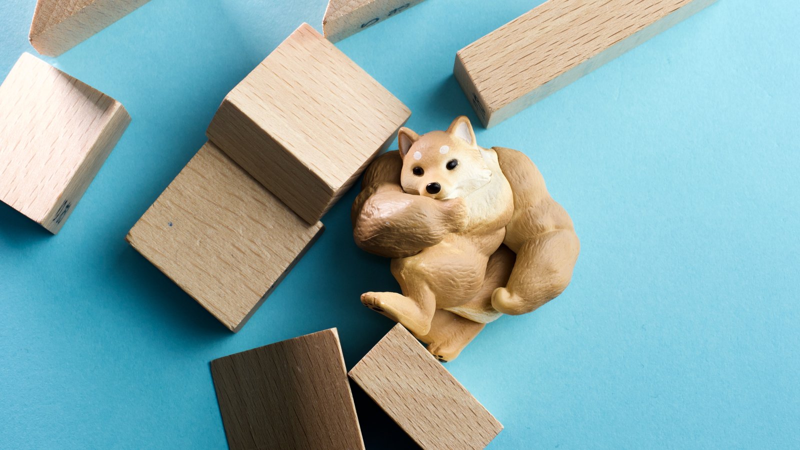 Swole doge breaking through blocks representing Dogecoin Price Predictions.