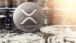 A concept token for XRP with stacks of tokens in the background.  XRP Price Predictions.