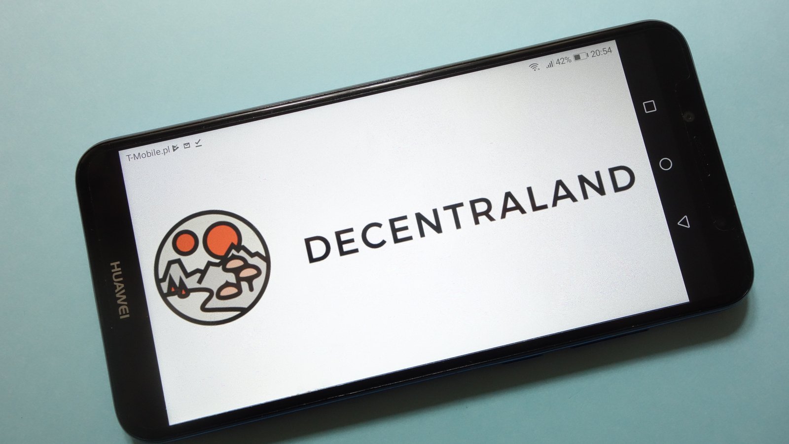 Decentraland logo displayed on smartphone screen, teal background behind the phone