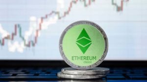 A rendered image of an Ethereum Classic coin shown against a price chart.