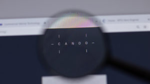 A magnifying lens over the Canoo company website