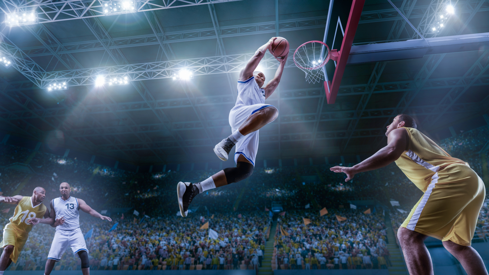 A basketball player makes a slam dunk in a crowded arena BABA Stock.