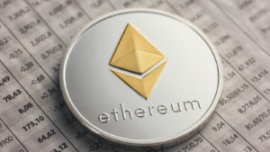 A coin with the Ethreum logo on top of a financial document