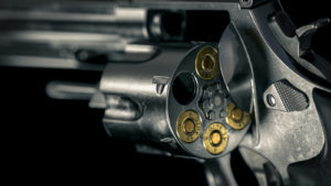 A 3D render of a Smith & Wesson Model 625 revolver with bullets in several of the chambers.
