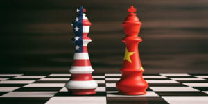 US America and China flags on chess kings on a chess board