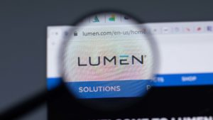 A magnifying glass zooms in on the website for Lumen Technologies (LUMN).