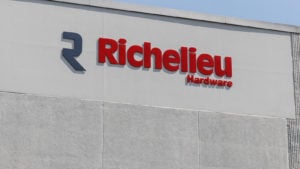 The top of a gray building with the logo for Richelieu Hardware on the side.